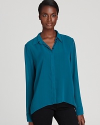 Semi-sheer chiffon lends a seductive twist to this BCBGeneration shirt, complete with an on-trend high/low hem.