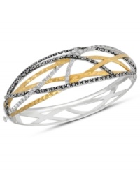 A woven web of sparkle and shine. Genevieve & Grace's chic crisscross bangle combines sterling silver and 18k gold over sterling silver with glittering marcasite accents. Approximate length: 7 inches.