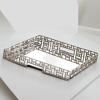 Dozens of square and rectangular cutouts give this serving tray from Natori a modern, dimensional look.