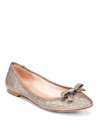 VINCE CAMUTO updates classic ballet flats with pointed toes, gracefully low vamps and a dash of sparkle.