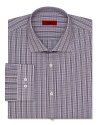 A regular fit HUGO dress shirt touts traditional barrel cuffs and timeless plaid for effortless office polish.