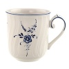 Delicate dark blue floral sprays adorn this timeless mug made from premium porcelain.