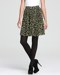 A DIANE von FURSTENBERG skirt flaunts a bold abstract print, bringing spot-on style to your very day. Opaque tights transition the look into the new season with chic.