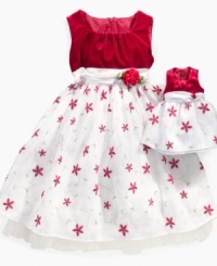 Her and her little dollie will have a holly jolly holiday in this lovely star-embroidered dress from Sweet Heart Rose.