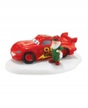 A hotshot on the track and under the tree, Disney Pixar's Lightning McQueen gets treated to a holiday tuneup at the North Pole Village in this winning figurine from Department 56.