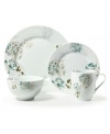 Romance blossoms at tables of Silk Floral dinnerware. Modern, fuss-free porcelain from Mikasa's collection of place settings bears artsy garden blooms in teal and cream for a look of serene grace and femininity. Place setting shown with charger plate.