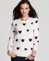 Fall in love with a heart print French Connection sweater and see ooh-la-la to this très chic style.