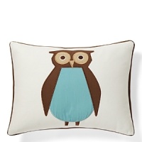 A large wide-eyed owl in soft brown and blue on off-white cotton canvas.The American Academy of Pediatrics and the U.S. Consumer Product Safety Commission have made recommendations for safe bedding practices for babies. When putting infants under 12 months to sleep, remove pillows, quilts, comforters, and other soft items from the crib.