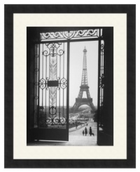 The defining symbol of the City of Lights, the soaring Eiffel Tower is the focal point of this elegant black-and-white print, taken from the famous Trocadero Esplanade in Paris. A satin black frame creates a sleek modern finish.