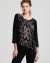 A tribal, burnout pattern lends exotic charm to this slouchy Rebecca Taylor top with chic dolman sleeves.