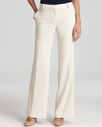 Embrace a clear vision of the season to come with crisp, classically tailored Jones New York Collection pants. The wide-leg silhouette lends itself to polished pumps for effortless sophistication.