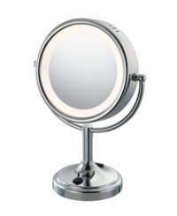 Put some light on the subject. This double-sided vanity mirror offers an enlightened view with a touch-control light along the mirror's circular rim.