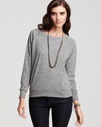 A luxe take on a sporty favorite, this ALTERNATIVE sweatshirt defines easy-chic living.