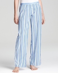 Transition from season to season in Calvin Klein Underwear's striped pajama pants, featuring buttons to roll up to capri length.