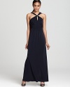 In fluid jersey, this Amsale dress lends a modern look with a minimalist silhouette that highlights a knotted neckline.