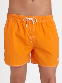 With stitched details and a grip-tape back patch pocket, these stylish swim trunks are both sporty and functional.Elastic drawstring waistStich detail at flySlash side pocketsBack grip-tape patch pocketInseam, about 4½PolyamideMachine washImported