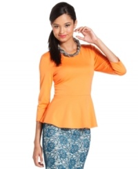 A ruffled peplum hem adds feminine flair to this Bar III Front Row top -- perfect for day-to-night dressing!