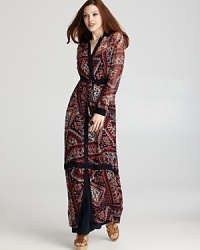 Sam & Lavi channels bohemian luxe with this floor-sweeping maxi dress, emboldened by a global-inspired print.