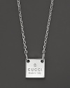 This sterling silver chain bears a Gucci trademark square pendant.