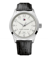 Timeless design with classic appeal, by Tommy Hilfiger. Watch crafted from black croc-embossed leather strap and round silvertone mixed metal case. Textured silvertone dial features applied numerals, date window at six o'clock and iconic flag logo. Quartz movement. Water resistant to 30 meters. Ten-year limited warranty.