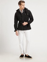 This modern iteration of a classic utility jacket is crafted from sleek waxed cotton, offering rugged style and water-repellent function.Zip frontSnap button placketAttached drawstring hoodChest and waist flap pocketsBelted waistFully linedAbout 31 from shoulder to hemCottonSponge cleanImported