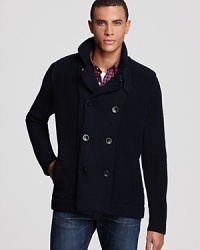 A clever knit wool design employs a classic pea coat silhouette for a unique take on casual cool warmth.