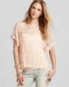 The boxy shape of this Free People top is offset by elegant lace, for a look with ladylike-cool appeal.