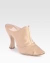 Shimmering satin in a classic silhouette with a unique contoured heel. Self-covered heel, 4 (100mm)Satin upperLeather lining and solePadded insoleMade in ItalyOUR FIT MODEL RECOMMENDS ordering one size up as this style runs small. 