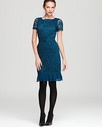 Demure yet dramatic, a timeless Tory Burch dress features a delicate lace overlay and ruffled hemline for an effortless romantic vision.