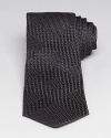 At first glance this handsome silk tie appears to offer a simple abstract texture, but spend more time here and note the carefully crafted pattern on the surface – a subtle but clear signature check design by none other than Burberry London.