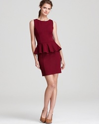 Flaunt fabulous feminine style in this peplum-adorned ponte dress from Aqua. Team with towering heels for added glamour.