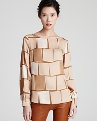 A three-dimensional square print decorates this silk Escada top for eclectic chic.