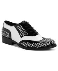 Borrowed from the boys–but way cooler. The Brogue oxford flats from Truth or Dare by Madonna feature high-contrast black and white patent and all-over stud details.