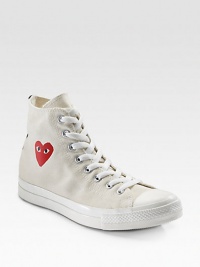 This canvas classic sports an eye-catching heart at the ankle and a contrast stripe at the heel. Rubber toe Lace-up front Painted heart on side Back stripe Padded insole Rubber sole Imported