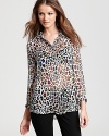 This seasonless Equipment shirt features a playful neon leopard print and a high/low hem on a lavish silk silhouette.