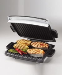 Get barbeque-style hot dogs or veggie burgers right in your kitchen with his new option from the George Foreman Grill line. It's large, 96-square-inch grill surface has room for multiple items at once and improved heat distribution. Other features include an oversize LED readout for variable temperature control and timer for cooking accuracy, a 1-inch floating hinge, a classic drip tray, a utensil that's gentle on the grill surface, and a silver metallic finish. Model GRP99.