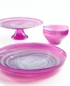 Adding a fun shock of color to modern settings, the large Sweet Plum dish from Sea Glasbruk pairs luminous violet with swirls of white in handcrafted glass.