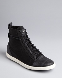 Nike picks up urban style influences in these canvas high top sneakers-meet-booties. Get ready to kick it around town.