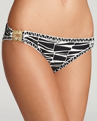 Sultry swimwear gets a warm welcome to the jungle in this Trina Turk zebra-patterned bikini bottom. Retro-inspired golden accents add a luxe touch.