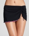 Ruffled pops of color define Gottex's popular, not-so-basic black swim bottom. This flirty skirt with a full bottom built in is perfect for beach volleyball, stand-up paddleboarding, jogging or just playing around poolside.