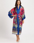 Solid contrast banding frames this silky-smooth design with an ornate print in rich jewel tones. V-neckThree-quarter length kimono sleevesSolid banded trimSelf-tie waistSlash pocketsAbout 49 from shoulder to hemPolyesterMachine washImported