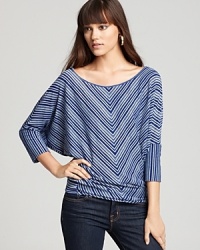 Hypnotic stripes and stylish dolman sleeves enliven this effortlessly-chic Velvet by Graham & Spencer top.