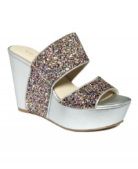 Stunning straps. Nine West's Larysa platform wedge sandals slide on comfortably and are super stylish too.