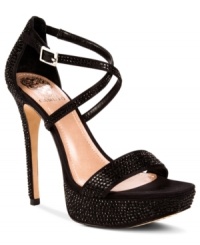 Glamour and glitz. Vince Camuto's platform evening sandals are fully covered in sparkly jewels and feature a sexy criss cross strap around the ankle.