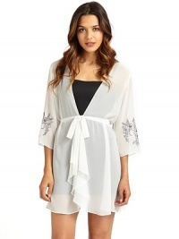 THE LOOKTailored from sheer georgetteWrap front with button closureFront tie waistThree-quarter length sleeves with floral embroidered cuffsTHE FITAbout 33 from shoulder to hemTHE MATERIALPolyesterCARE & ORIGINMachine washImported