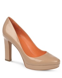 Via Spiga lends these work-ready platform pumps extra polish, in shining patent leather.