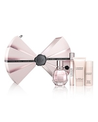 Opulent and full-bodied, Viktor & Rolf Flowerbomb is a floral explosion, a profusion of flowers that has the power to make everything more positive. This holiday, Flowerbomb dresses up in a signature V&R couture bow tie to reveal the sophisticated, feminine floral transformation within this beautiful holiday set.Gift set includes:- 1.7 fl. oz. Eau de Parfum Spray- 0.34 fl. oz. Eau de Parfum Rollerball- 1.7 fl. oz. Bomblicious Body Cream