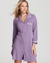 The comfort of his with the appeal of hers, this pocketed sleepshirt puts a twist on boyfriend style with floral applique detailing and soft colors.