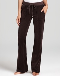 Snap-patch back pockets lend a utility-inspired feel to Juicy Couture's signature velour lounge pants.