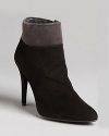 Stuart Weitzman takes his sophisticated booties over the top in term of style, with contrast cuffs that set this pair apart from the rest.